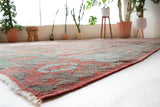 Vintage kilim rug in living room setting, old rug, antique rug, pastel colors, faded colors, Turkish rug, vintage rug, soft rug, Portland, Oregon, rug store, rug shop, local shop, earthy tones, earthy colors, warm colors