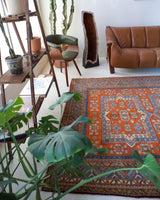 Vintage Turkish rug in a living room setting, pile rug, Turkish rug, vintage rug, portland, rug shop, bright colors, wild shaman, soft rug, bold color, Portland, Oregon, rug store, rug shop, local shop