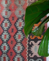 Vintage kilim rug in living room setting, old rug, antique rug, pastel colors, faded colors, Turkish rug, vintage rug, soft rug, Portland, Oregon, rug store, rug shop, local shop, earthy tones, earthy colors, warm colors