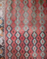 Vintage kilim rug in living room setting, old rug, antique rug, pastel colors, faded colors, Turkish rug, vintage rug, soft rug, Portland, Oregon, rug store, rug shop, local shop, earthy tones, earthy colors, warm colors