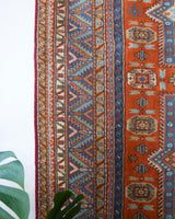 Vintage Turkish rug in a living room setting, pile rug, Turkish rug, vintage rug, portland, rug shop, bright colors, wild shaman, soft rug, bold color, Portland, Oregon, rug store, rug shop, local shop