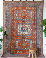Vintage Turkish rug in a living room setting, pile rug, Turkish rug, vintage rug, portland, rug shop, bright colors, wild shaman, soft rug, bold color, Portland, Oregon, rug store, rug shop, local shop