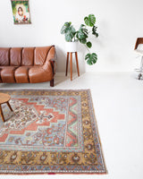 Vintage Turkish rug in living room setting, old rug, antique rug, pastel colors, faded colors, Turkish rug, vintage rug, soft rug, Portland, Oregon, rug store, rug shop, local shop