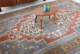 Vintage Turkish rug in living room setting, old rug, antique rug, pastel colors, faded colors, Turkish rug, vintage rug, soft rug, Portland, Oregon, rug store, rug shop, local shop