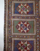 Vintage kilim rug in living room setting, old rug, antique rug, pastel colors, faded colors, Turkish rug, vintage rug, soft rug, Portland, Oregon, rug store, rug shop, local shop, earthy tones, earthy colors, warm colors