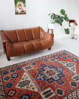 Vintage Turkish rug in a living room setting, pile rug, Turkish rug, vintage rug, portland, rug shop, bright colors, wild shaman, soft rug, bold color, Portland, Oregon, rug store, rug shop, local shop, antique rug