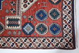 Vintage Turkish rug in a living room setting, pile rug, Turkish rug, vintage rug, portland, rug shop, bright colors, wild shaman, soft rug, bold color, Portland, Oregon, rug store, rug shop, local shop, antique rug