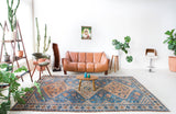 Vintage Turkish rug in living room setting, old rug, antique rug, pastel colors, faded colors, Turkish rug, vintage rug, soft rug, Portland, Oregon, rug store, rug shop, local shop