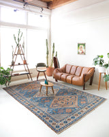 Vintage Turkish rug in living room setting, old rug, antique rug, pastel colors, faded colors, Turkish rug, vintage rug, soft rug, Portland, Oregon, rug store, rug shop, local shop