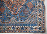 Vintage Turkish rug in living room setting, old rug, antique rug, pastel colors, faded colors, Turkish rug, vintage rug, soft rug, Portland, Oregon, rug store, rug shop, local shop