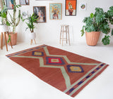 Vintage Turkish rug in a living room setting, pile rug, Turkish rug, vintage rug, portland, rug shop, bright colors, wild shaman, soft rug, bold color, Portland, Oregon, rug store, rug shop, local shop, antique rug