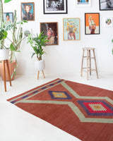 Vintage Turkish rug in a living room setting, pile rug, Turkish rug, vintage rug, portland, rug shop, bright colors, wild shaman, soft rug, bold color, Portland, Oregon, rug store, rug shop, local shop, antique rug