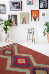 Vintage Turkish rug in a living room setting, pile rug, Turkish rug, vintage rug, portland, rug shop, bright colors, wild shaman, soft rug, bold color, Portland, Oregon, rug store, rug shop, local shop, antique rug