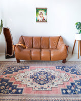 Vintage Turkish rug in living room setting, old rug, antique rug, pastel colors, faded colors, Turkish rug, vintage rug, soft rug, Portland, Oregon, rug store, rug shop, local shop
