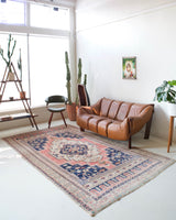 Vintage Turkish rug in living room setting, old rug, antique rug, pastel colors, faded colors, Turkish rug, vintage rug, soft rug, Portland, Oregon, rug store, rug shop, local shop
