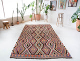Vintage Turkish rug in a living room setting, pile rug, Turkish rug, vintage rug, portland, rug shop, bright colors, wild shaman, soft rug, bold color, Portland, Oregon, rug store, rug shop, local shop, antique rug