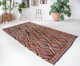 Vintage Turkish rug in a living room setting, pile rug, Turkish rug, vintage rug, portland, rug shop, bright colors, wild shaman, soft rug, bold color, Portland, Oregon, rug store, rug shop, local shop, antique rug