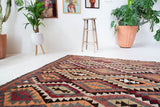 Vintage Turkish rug in a living room setting, pile rug, Turkish rug, vintage rug, portland, rug shop, bright colors, wild shaman, soft rug, bold color, Portland, Oregon, rug store, rug shop, local shop, antique rug