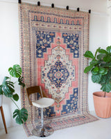 Vintage Turkish rug in living room setting, old rug, antique rug, pastel colors, faded colors, Turkish rug, vintage rug, soft rug, Portland, Oregon, rug store, rug shop, local shop