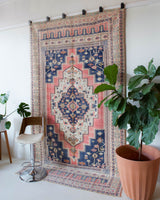 Vintage Turkish rug in living room setting, old rug, antique rug, pastel colors, faded colors, Turkish rug, vintage rug, soft rug, Portland, Oregon, rug store, rug shop, local shop