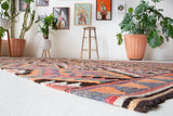 Vintage Turkish rug in a living room setting, pile rug, Turkish rug, vintage rug, portland, rug shop, bright colors, wild shaman, soft rug, bold color, Portland, Oregon, rug store, rug shop, local shop, antique rug