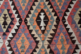 Vintage Turkish rug in a living room setting, pile rug, Turkish rug, vintage rug, portland, rug shop, bright colors, wild shaman, soft rug, bold color, Portland, Oregon, rug store, rug shop, local shop, antique rug
