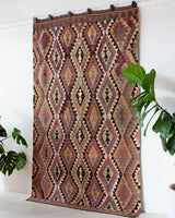 Vintage Turkish rug in a living room setting, pile rug, Turkish rug, vintage rug, portland, rug shop, bright colors, wild shaman, soft rug, bold color, Portland, Oregon, rug store, rug shop, local shop, antique rug