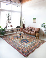 Vintage Turkish rug in living room setting, old rug, antique rug, pastel colors, faded colors, Turkish rug, vintage rug, soft rug, Portland, Oregon, rug store, rug shop, local shop
