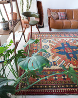 Vintage Turkish rug in living room setting, old rug, antique rug, pastel colors, faded colors, Turkish rug, vintage rug, soft rug, Portland, Oregon, rug store, rug shop, local shop
