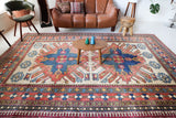 Vintage Turkish rug in living room setting, old rug, antique rug, pastel colors, faded colors, Turkish rug, vintage rug, soft rug, Portland, Oregon, rug store, rug shop, local shop