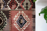 Vintage kilim rug in living room setting, old rug, antique rug, pastel colors, faded colors, Turkish rug, vintage rug, soft rug, Portland, Oregon, rug store, rug shop, local shop, earthy tones, earthy colors, warm colors