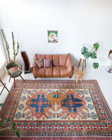 Vintage Turkish rug in living room setting, old rug, antique rug, pastel colors, faded colors, Turkish rug, vintage rug, soft rug, Portland, Oregon, rug store, rug shop, local shop