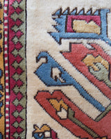 Vintage Turkish rug in living room setting, old rug, antique rug, pastel colors, faded colors, Turkish rug, vintage rug, soft rug, Portland, Oregon, rug store, rug shop, local shop