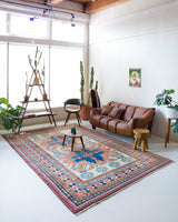Vintage Turkish rug in living room setting, old rug, antique rug, pastel colors, faded colors, Turkish rug, vintage rug, soft rug, Portland, Oregon, rug store, rug shop, local shop