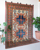 Vintage Turkish rug in living room setting, old rug, antique rug, pastel colors, faded colors, Turkish rug, vintage rug, soft rug, Portland, Oregon, rug store, rug shop, local shop