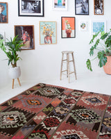 Vintage kilim rug in living room setting, old rug, antique rug, pastel colors, faded colors, Turkish rug, vintage rug, soft rug, Portland, Oregon, rug store, rug shop, local shop, earthy tones, earthy colors, warm colors