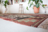 Vintage kilim rug in living room setting, old rug, antique rug, pastel colors, faded colors, Turkish rug, vintage rug, soft rug, Portland, Oregon, rug store, rug shop, local shop, earthy tones, earthy colors, warm colors
