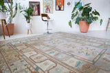 Vintage Turkish runner rug in living room setting, old rug, antique rug, pastel colors, faded colors, Turkish rug, vintage rug, soft rug, Portland, Oregon, rug store, rug shop, local shop