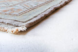 Vintage Turkish runner rug in living room setting, old rug, antique rug, pastel colors, faded colors, Turkish rug, vintage rug, soft rug, Portland, Oregon, rug store, rug shop, local shop
