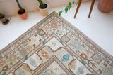 Vintage Turkish runner rug in living room setting, old rug, antique rug, pastel colors, faded colors, Turkish rug, vintage rug, soft rug, Portland, Oregon, rug store, rug shop, local shop