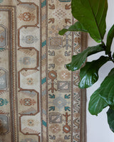 Vintage Turkish runner rug in living room setting, old rug, antique rug, pastel colors, faded colors, Turkish rug, vintage rug, soft rug, Portland, Oregon, rug store, rug shop, local shop