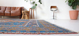 Vintage Turkish rug in a living room setting, pile rug, Turkish rug, vintage rug, portland, rug shop, bright colors, wild shaman, soft rug, bold color, Portland, Oregon, rug store, rug shop, local shop