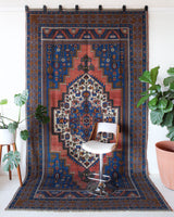 Vintage Turkish rug in a living room setting, pile rug, Turkish rug, vintage rug, portland, rug shop, bright colors, wild shaman, soft rug, bold color, Portland, Oregon, rug store, rug shop, local shop