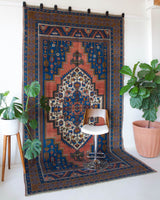 Vintage Turkish rug in a living room setting, pile rug, Turkish rug, vintage rug, portland, rug shop, bright colors, wild shaman, soft rug, bold color, Portland, Oregon, rug store, rug shop, local shop