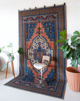 Vintage Turkish rug in a living room setting, pile rug, Turkish rug, vintage rug, portland, rug shop, bright colors, wild shaman, soft rug, bold color, Portland, Oregon, rug store, rug shop, local shop