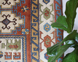 Vintage Turkish rug in a living room setting, pile rug, Turkish rug, vintage rug, portland, rug shop, bright colors, wild shaman, soft rug, bold color, Portland, Oregon, rug store, rug shop, local shop