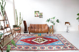 Vintage Turkish rug in a living room setting, pile rug, Turkish rug, vintage rug, portland, rug shop, bright colors, wild shaman, soft rug, bold color, Portland, Oregon, rug store, rug shop, local shop