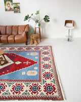 Vintage Turkish rug in a living room setting, pile rug, Turkish rug, vintage rug, portland, rug shop, bright colors, wild shaman, soft rug, bold color, Portland, Oregon, rug store, rug shop, local shop