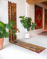 Vintage Turkish runner rug in a living room setting, pile rug, Turkish rug, vintage rug, portland, rug shop, bright colors, wild shaman, soft rug, bold color, Portland, Oregon, rug store, rug shop, local shop, antique rug