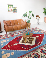 Vintage Turkish rug in a living room setting, pile rug, Turkish rug, vintage rug, portland, rug shop, bright colors, wild shaman, soft rug, bold color, Portland, Oregon, rug store, rug shop, local shop